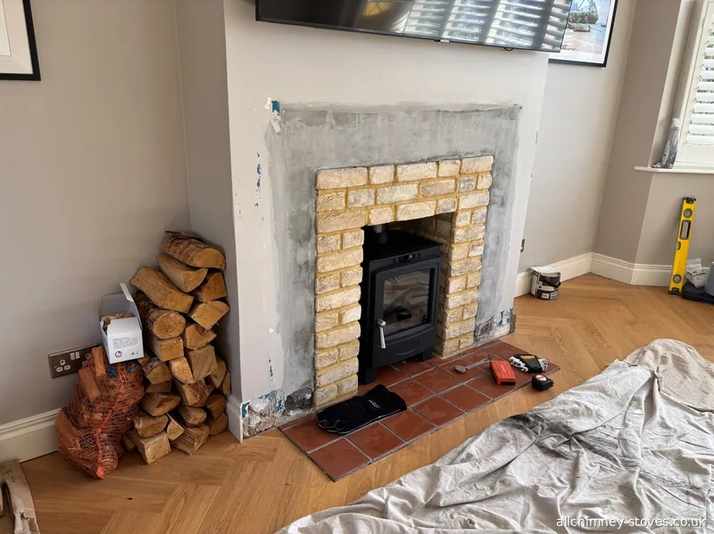 HETAS registered stove installation, brick slip lined firebox and surround, terracotta earthenware hearth tiles, 125mm flexible flue liner, Collier Row Romford