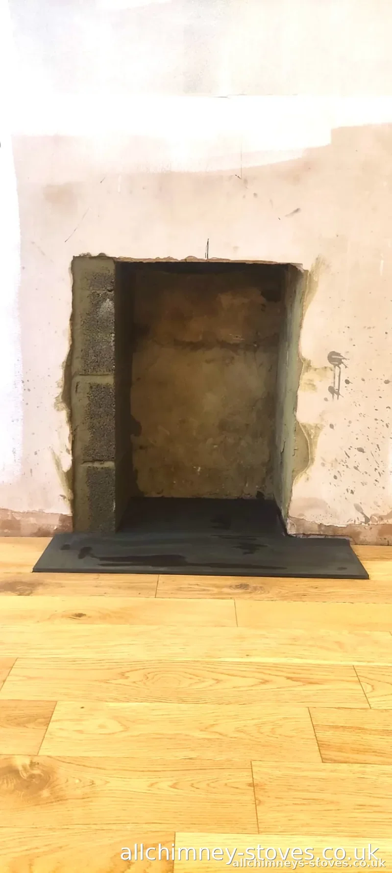 HETAS certified modified stove installation — builder's opening cleared, slate hearth ready, Allchimney Stoves, Hornchurch