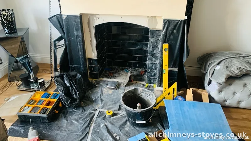 HETAS certified stove installation — black metro tiles being laid, fireplace modification in progress, Allchimney Stoves, Collier Row Romford