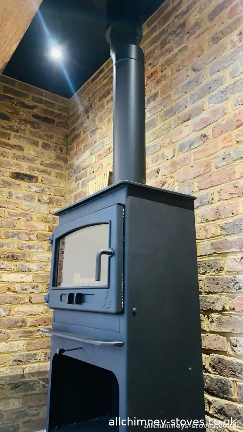 HETAS certified freestanding stove installation — twin wall flue in exposed brick extension, Allchimney Stoves, Gidea Park Romford