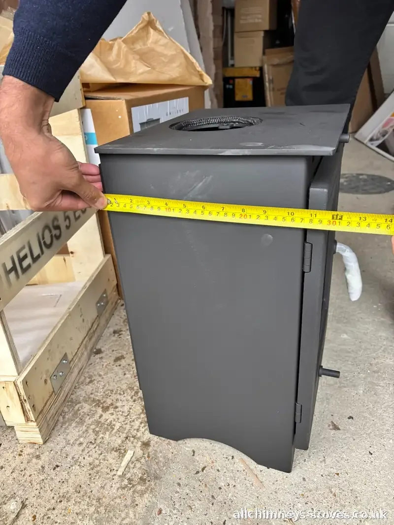 HETAS certified stove fitter — pre-installation width measurement, Helios 5 Eco multifuel stove, confirming fit before chimney lining, Allchimney Stoves, Emerson Park