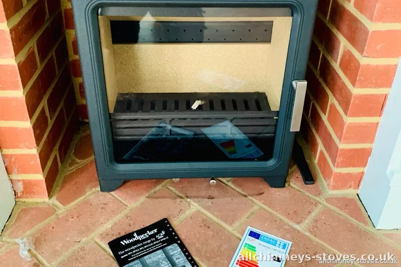 HETAS certified stove installation — Woodpecker WP5 Plus new install, brick opening, terracotta hearth, Allchimney Stoves, Collier Row Romford