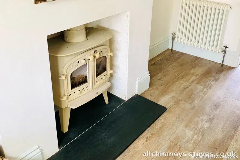 HETAS certified stove installer — Charnwood stove resprayed almond, reinstalled in plastered chimney breast opening, solid fuel appliance refurbishment, Allchimney Stoves, Harold Hill