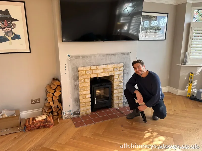 HETAS certified stove installation completed — exposed brick arch opening, terracotta hearth, Allchimney Stoves, Hornchurch